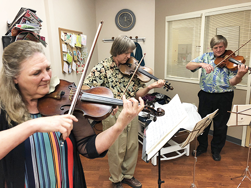 Violin family Susan Doering playing violin with family