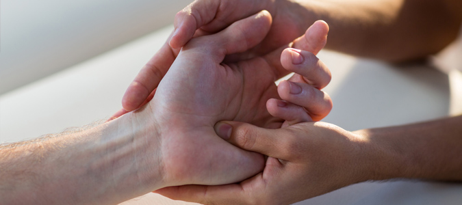 Physiotherapist giving hand massage to patient Physiotherapist giving hand massage to patient