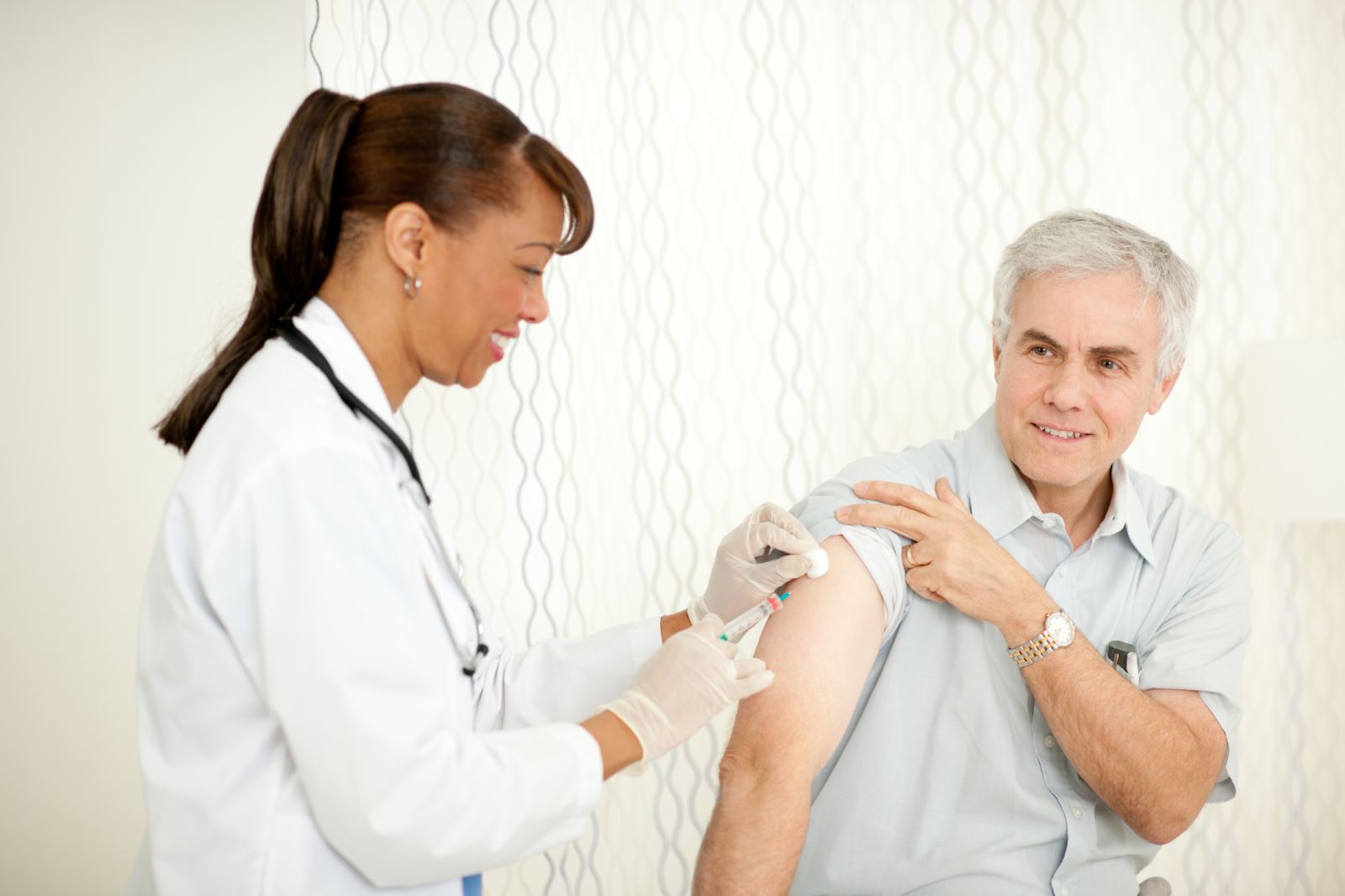 iStock_000018329949_Large Doctor Giving a Patient a Shot