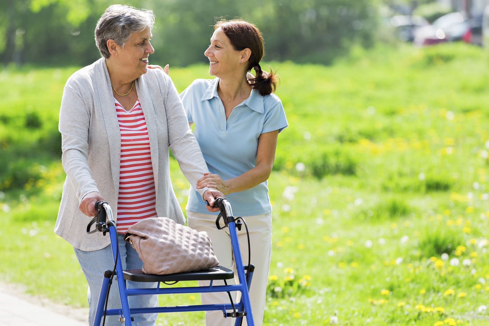 iStock_000039334642_Large Female family member helping Older member in a walker